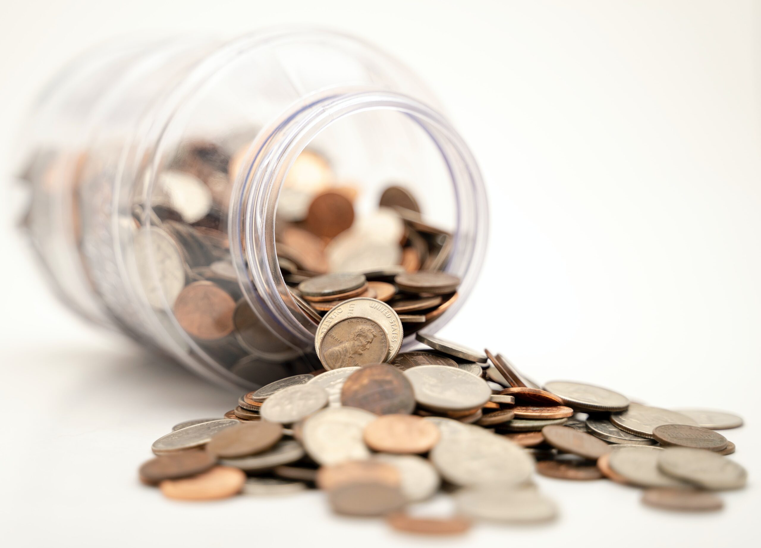 An image of a jar on money.