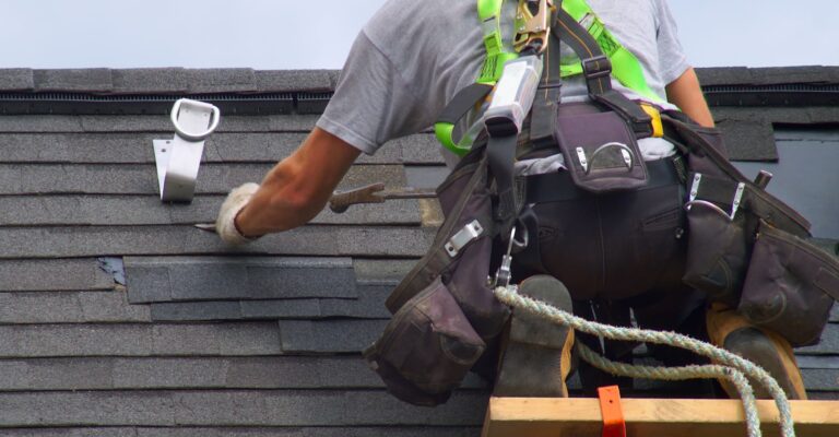 A contractor replacing a roof