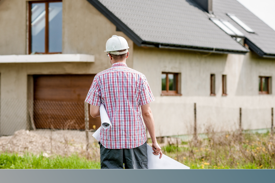 contractor looks at roof
