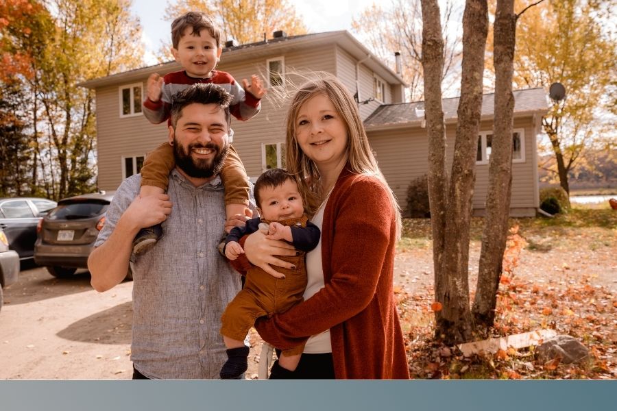 family stands in front of Tennessee house